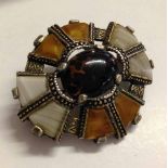 A c1950/60s Scottish 'Miracle' brooch with white and yellow agates surrounding a central dendretic