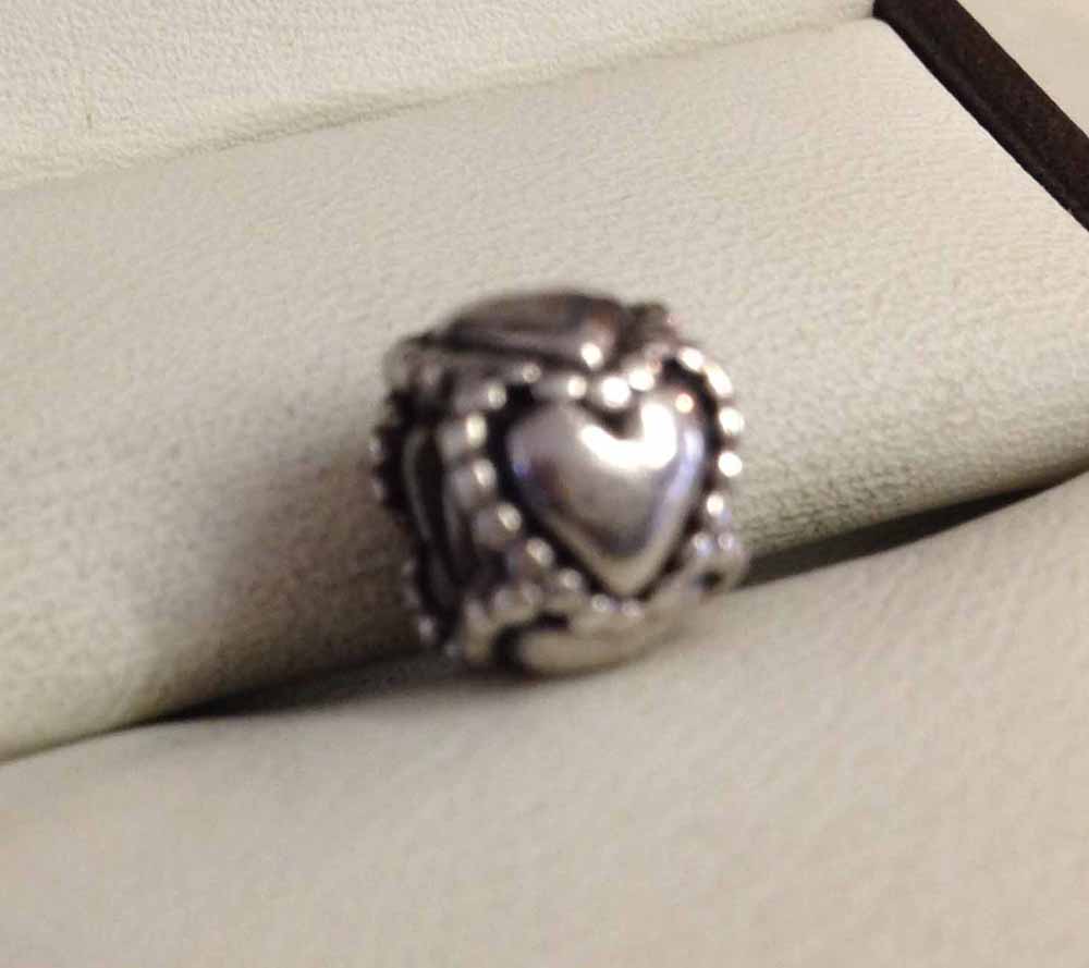 Pandora silver heart charm (circular).