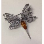 Silver 'Mayfly' brooch with oval amber cabouchon.