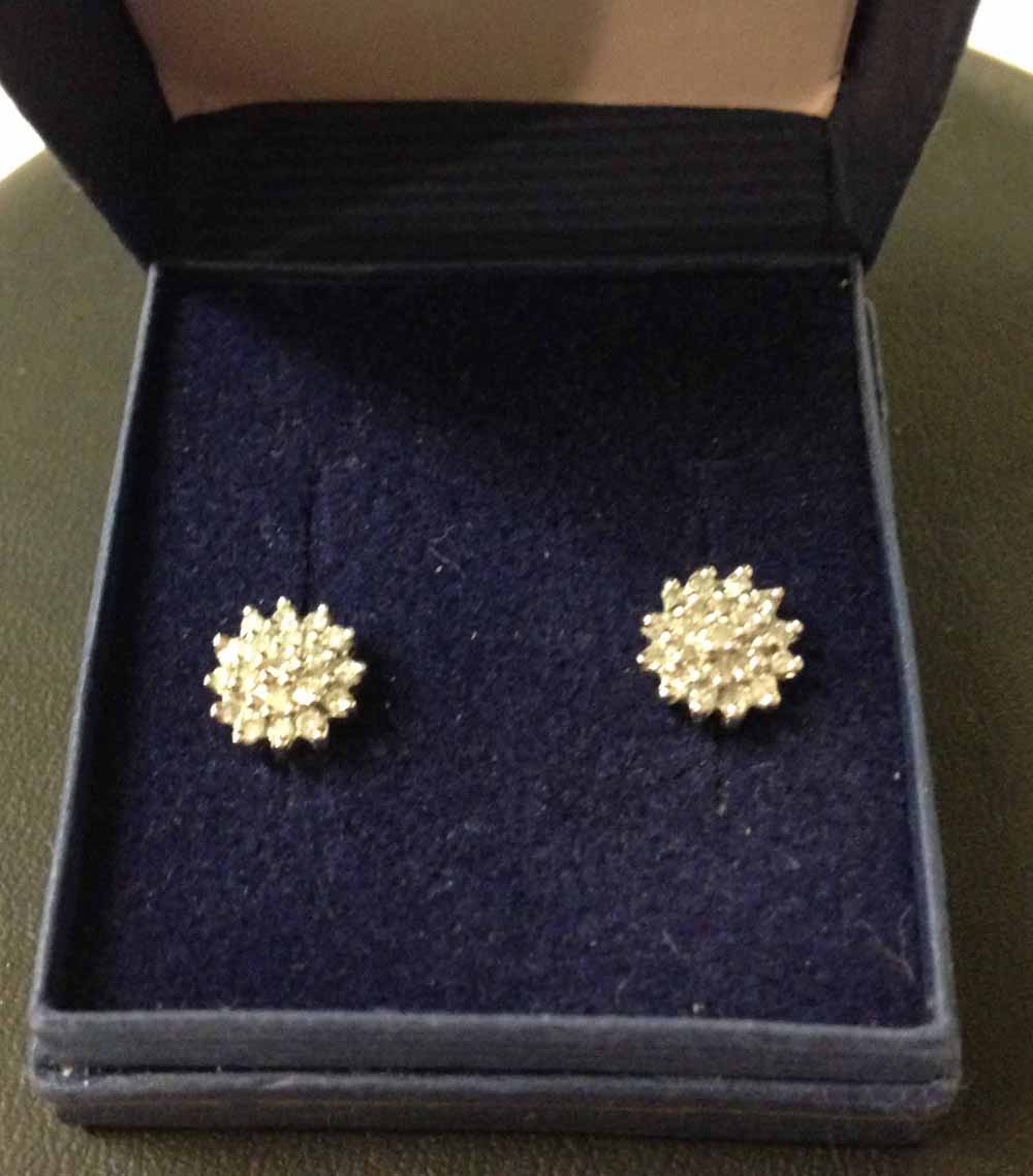 A pair of 9ct gold & diamond cluster earrings.