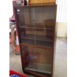 A glass fronted display cabinet. Size 145 x 69cm.