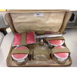 A ladies guilloche pink enamel travelling vanity case by Two-Tix in leather case.