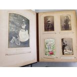A Victorian 'Floral' photograph album with approx 86 photographs to include Queen Victoria, Prince