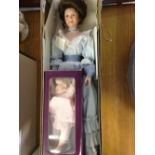 A boxed porcelain 2 doll set 'Loving Steps' (mother & child) by Sandra Ruck by Reco. Part of the '