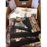 A box of assorted stamps & 1st day covers.