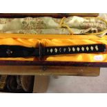 A Katana Samurai sword with Tamahagne steel blade in original case and silk cover. Made to order