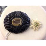 Antique Whitby Jet oval carved mourning brooch, with central compartment - possibly for hair,