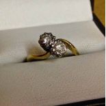 An 18ct gold & diamond ring set with 2 diamonds, each stone approx 0.2 carat. Size K.