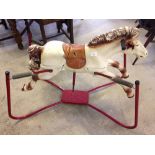 A vintage sprung rocking horse c1960-70s.