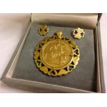 An 1890 Victorian gold sovereign in heart decorated mount & matching earrings (tests as 9ct).