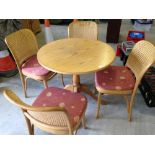 A round conservatory table & 4 chairs.