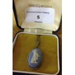 A boxed Wedgwood blue jasperware pendant in a silver oval mount on a 16 inch silver chain.