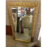 A gilt framed mirror. 60 x 105cm.