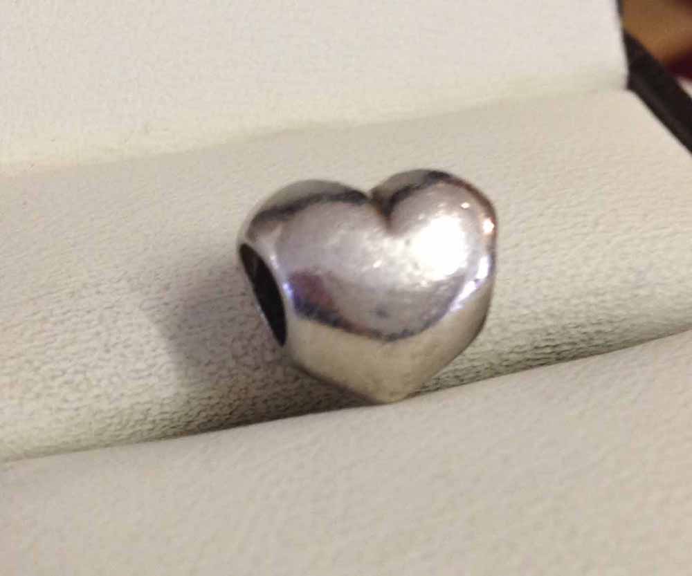Pandora silver heart charm.