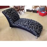 A modern black & grey upholstered chaise longue.