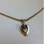 9ct HM necklace with open heart pendant set with green stone, weight approx. 2.6g