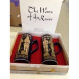 A boxed pair of Hornsea Pottery, Wars of the Roses tall mugs.