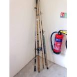 4 vintage fishing rods to include a bamboo cane sea rod with Penn Senator 113 reel