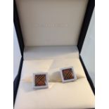 A boxed pair of designer Burberry cufflinks.