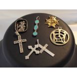 A collection of 6 pendants to include St. Christopher, crosses & an oriental symbol.