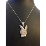 A 925 silver Playboy bunny style pendant set with white stones, on a silver chain.