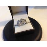 A heavy 925 silver ring with D & G design set with white stones. Size approx Q