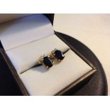 A pair of 15ct gold earrings set with blue & white sapphires and 18ct backs.