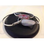 3 decorative silver bangles, 2 with pearlised decoration and the other set with a crystal.