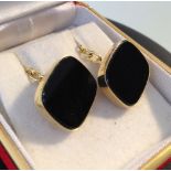 A 14ct gold pair of Onyx cufflinks.