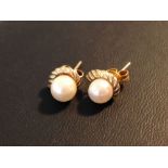 A pair of 9ct gold & pearl earrings.