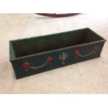 A cast iron painted windowbox / planter, 60cm wide.