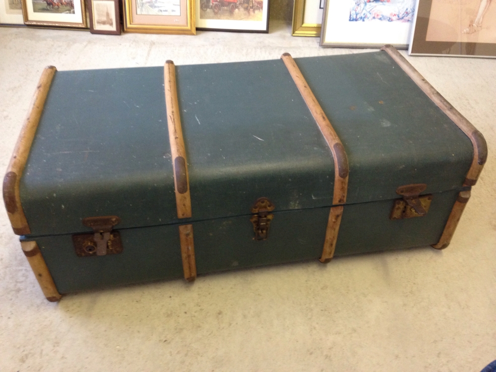 A vintage blue wooden banded trunk