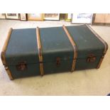 A vintage blue wooden banded trunk