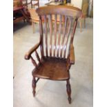 An antique oak farmhouse chair.