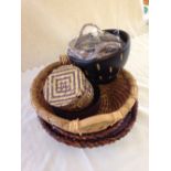 A collection of 5 wicker/raffia bowls & 2 handmade wooden bowls.