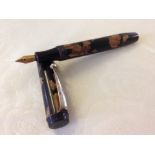 Marbled Pump Filler Pen c1930s.Of unknown manufacture, black and gold marbled celluloid with flat