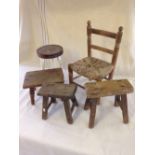 A vintage childs rush seated chair with 4 vintage small stools.
