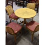 A round conservatory table & 4 chairs.