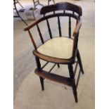 A vintage oak childs high chair.