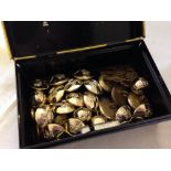 A tin box of military buttons.