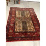 A vintage red & cream patterned wool rug /carpet. Approx 200 x 140cm - no fringing.