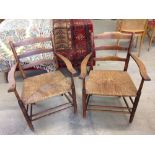 A pair of vintage rush seated ladder back chairs.