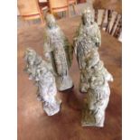 4 concrete gardens ornaments of religious figures approx 24cm to 29cm tall.