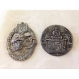 2 German military badges: a 1933 Munich Nazi 'tinnie' and a tank badge.