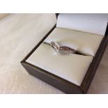 9ct white gold V ring set with cubic zirconias, size approx N