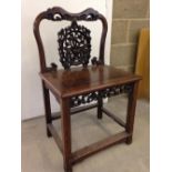 A late 19th/early 20th century Chinese rosewood carved chair.