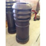 A vintage dark brown, fluted top chimney pot, approx 88cm tall.