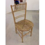 A vintage bamboo rush seated chair.