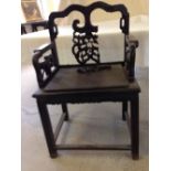 A late 19th/early 20th century Chinese rosewood carved chair in need of some restoration -