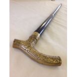 A brass handled ebony sectional walking stick.